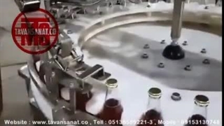 دستگاه خط پرکنی و دربندی شیشه شربت با درب تشتکی توان صنعت / 09152000050