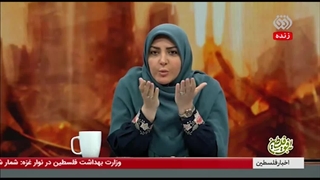 هنگام پخش زندۀ تلویزیون از غزه کودکی که تازه شهید شده بود را مردم جلوی دوربین ها آوردند
